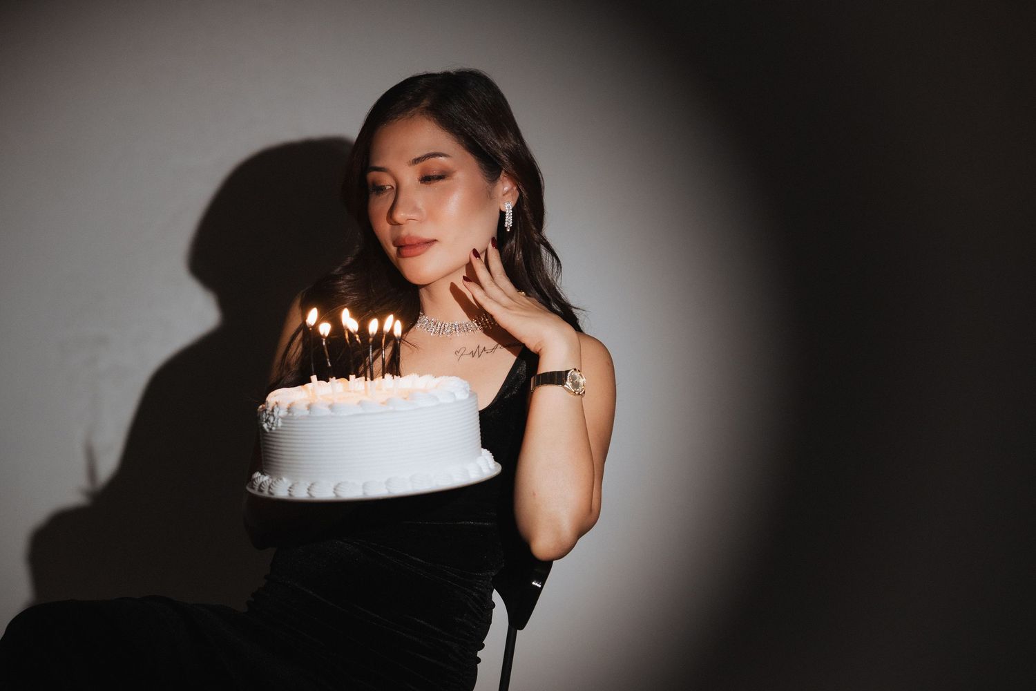 Creative birthday portrait session in Dubai with dramatic spotlight lighting