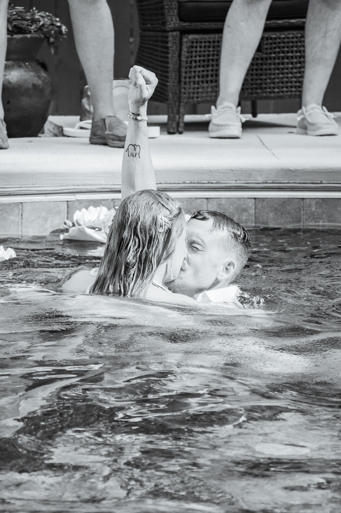 Bride & Groom kissing in pool, Groom with fist in air | K Murphy Photos | Roanoke, Virginia | Wedding & Event Photography