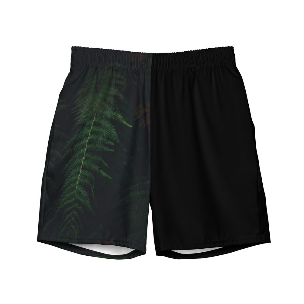 Men's black athletic shorts with green leaf pattern against a white background in different views.