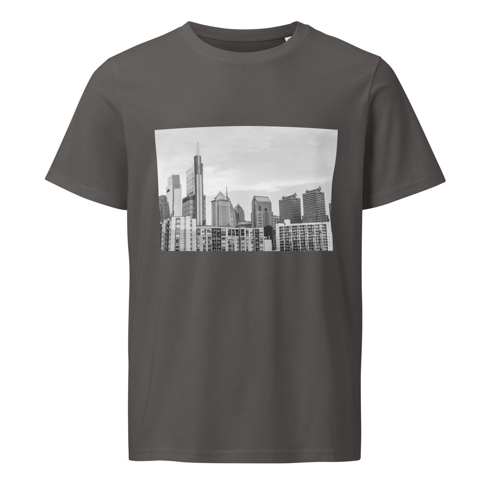 Urban skyline graphic printed on gray t-shirts showing modern city buildings in minimalist black and white design.