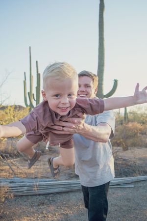 family plays together in Saguaro National Park, Tucson, Arizona, Sonoran Desert