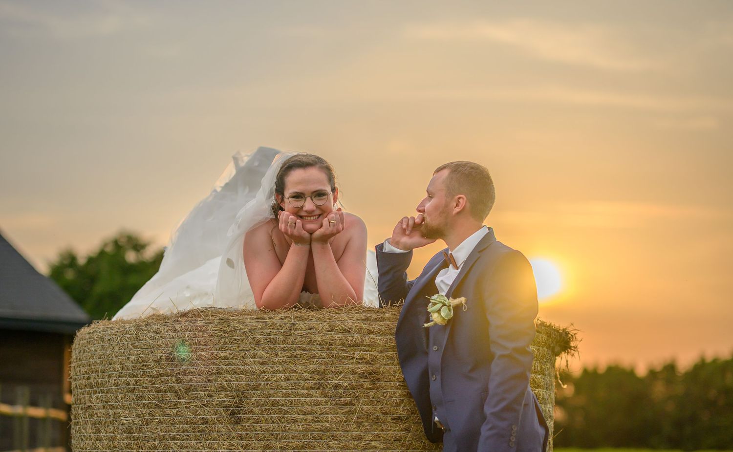 Wedding photography sequence in black and white showing romantic poses against stone archway ruins.