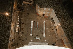 Aerial view of an outdoor wedding venue setup with chairs and decorations.