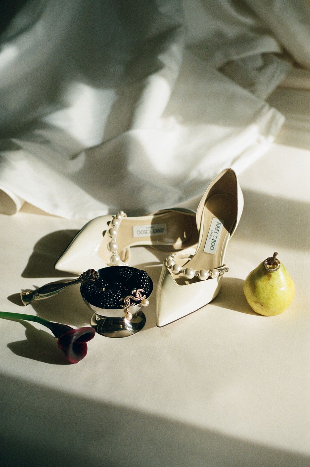 A sequence of artistic photos showing elegant high heeled shoes casting dramatic shadows in soft natural light.
