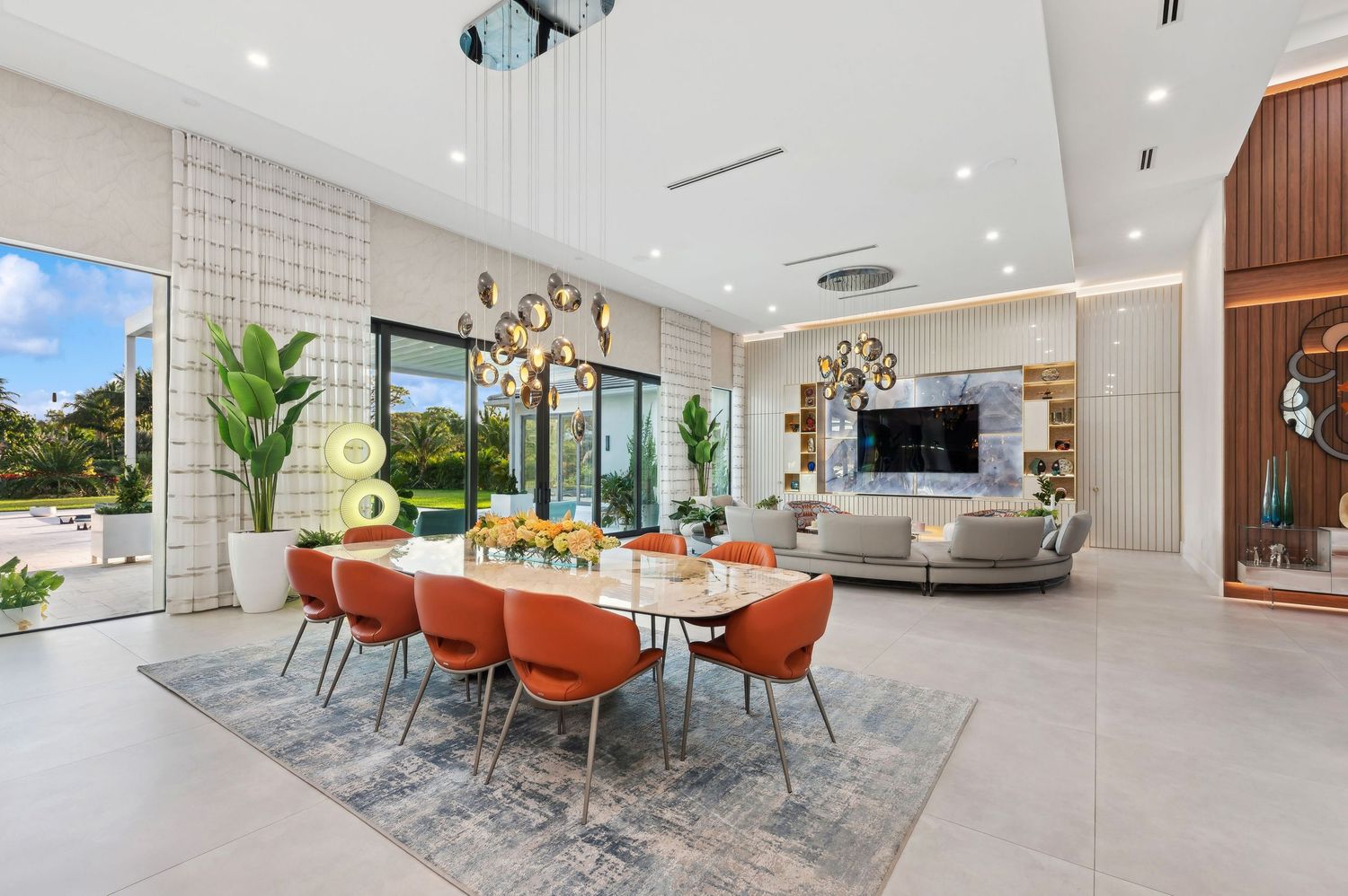 Real estate photography for this luxurious open-concept living and dining area in Boca Raton Real estate photographer in Palm Beach County