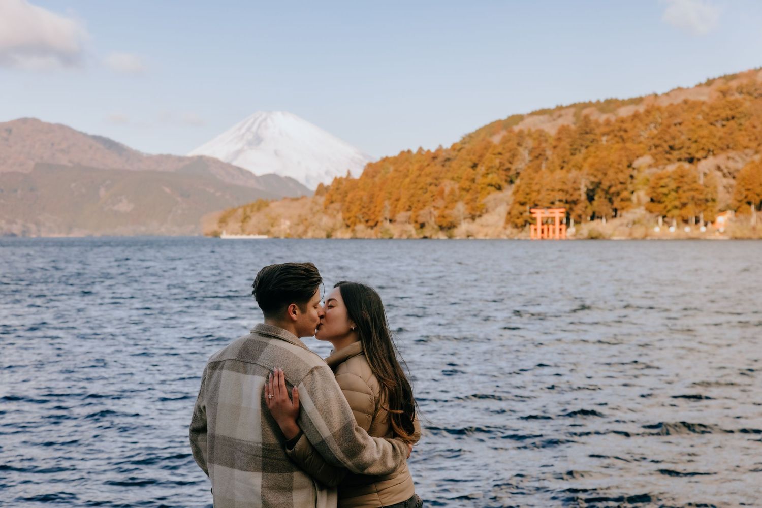 Couple engagement photo at Lake Ashi Hakone with Mount Fuji in the background