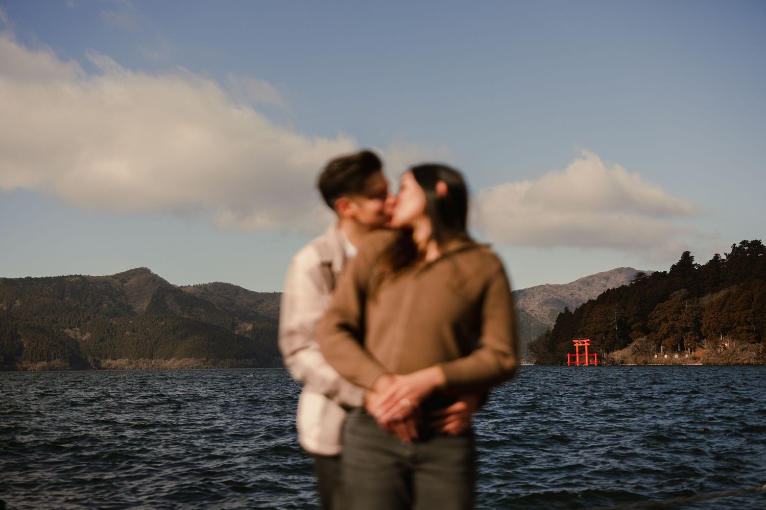 Couple engagement photo at Lake Ashi Hakone with Mount Fuji in the background