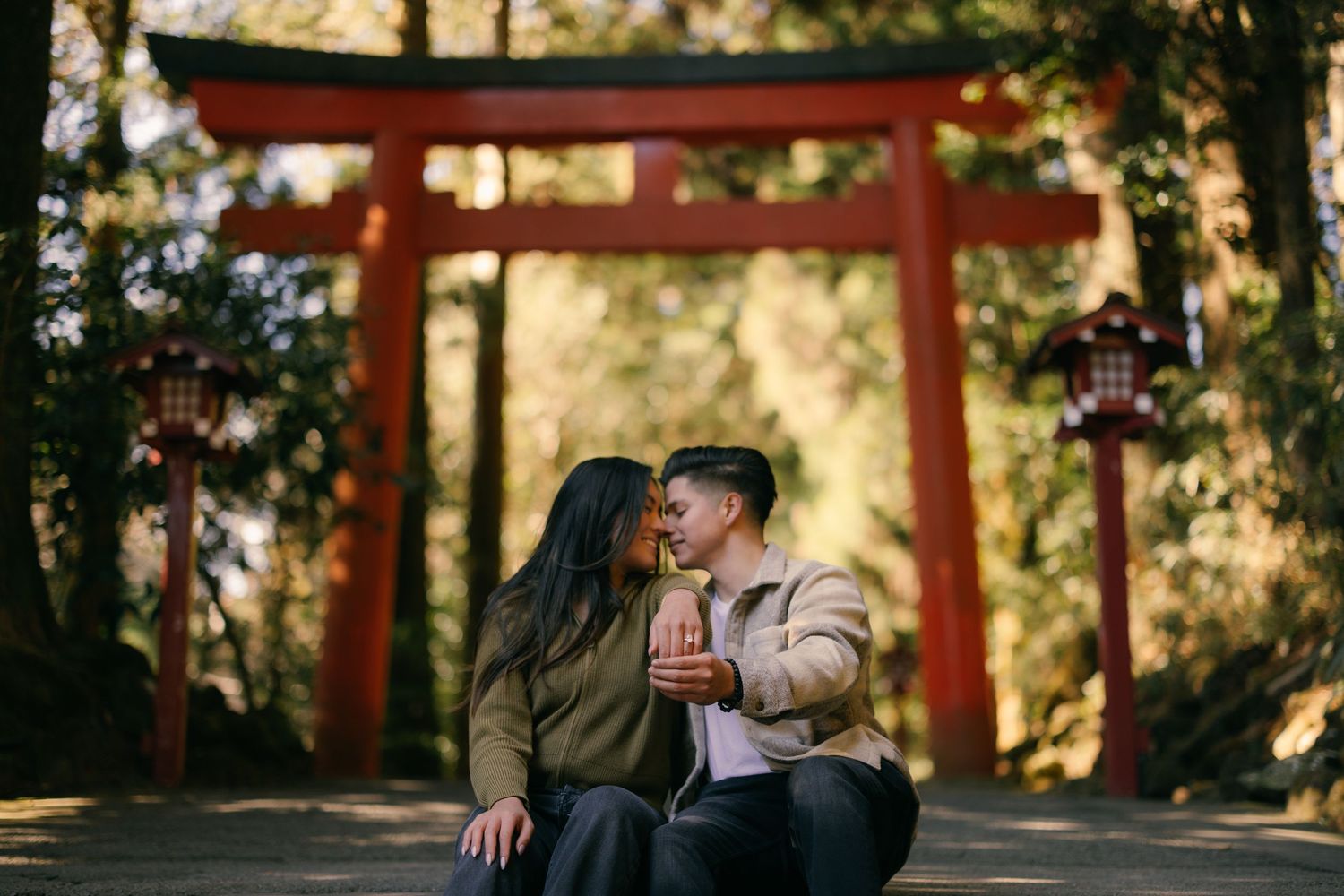 Couple engagement photo at red Torii gate at Hakone shrine