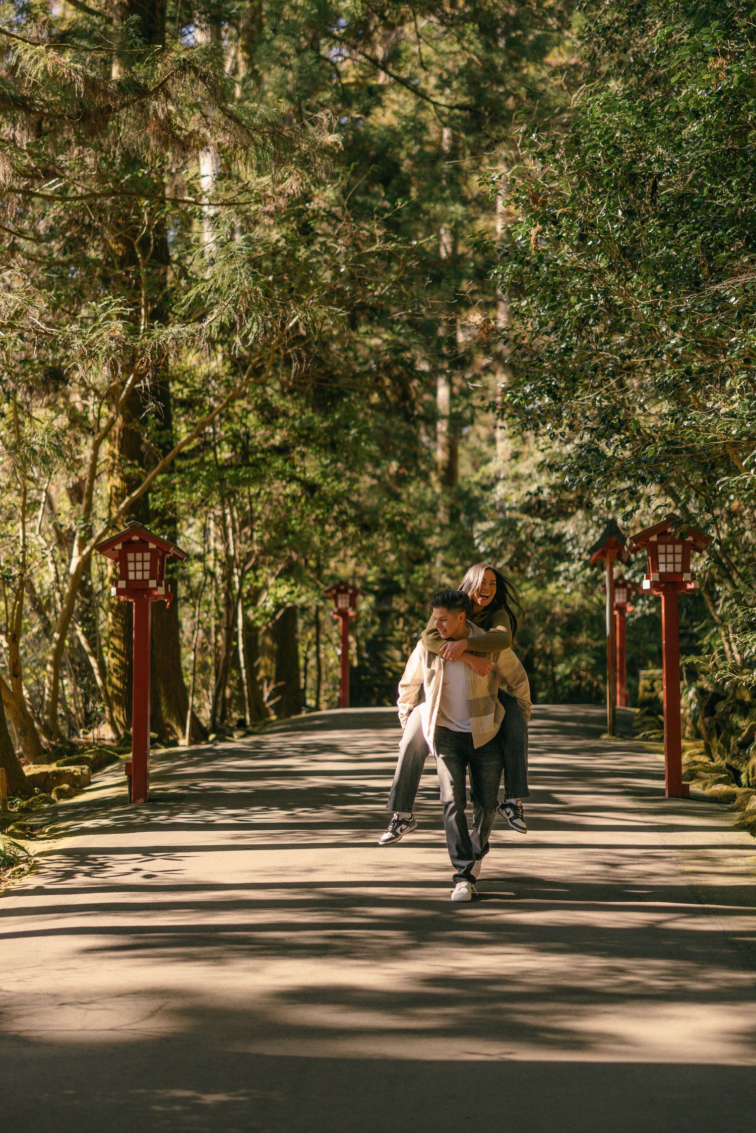 Couple engagement photo at red Torii gate at Hakone shrine