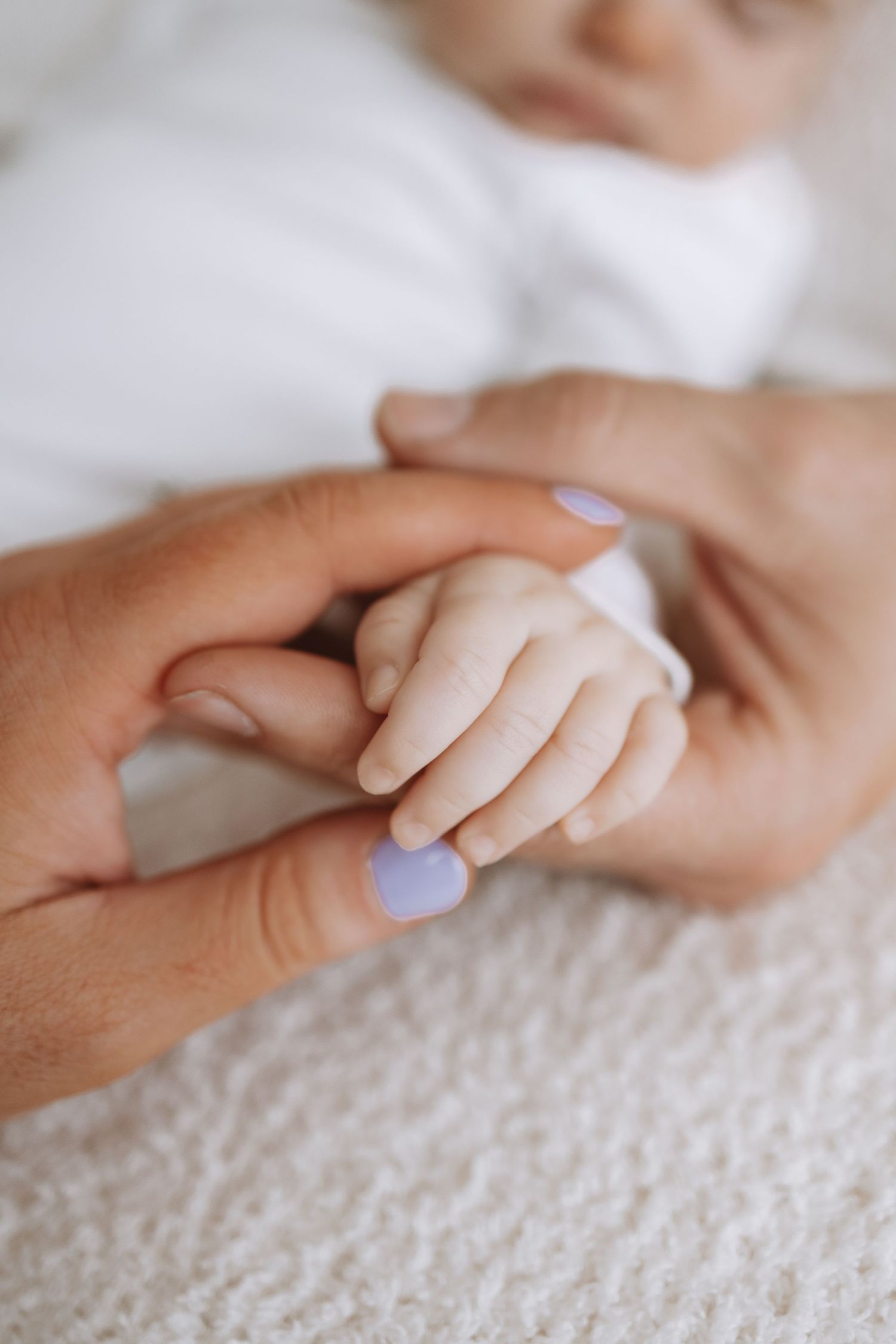A tender moment captured in a series of soft, intimate photos showing affection and bonding between parent and child.