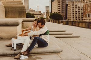Urban rooftop pottery date with historic buildings visible in the background.