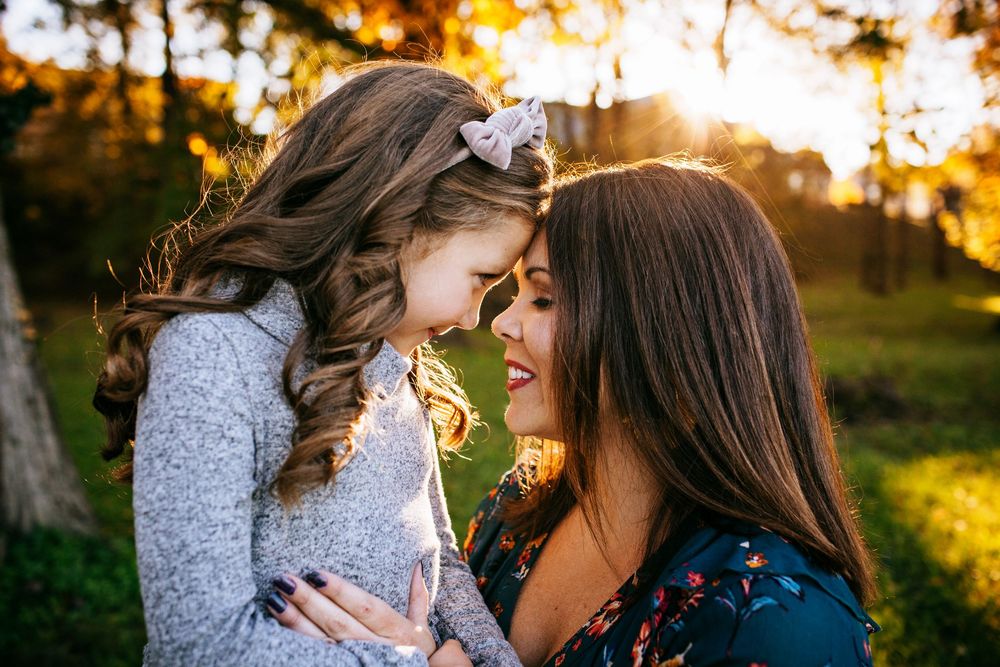 Emotional mother daughter moment during golden hour - Springfield, MO family photographer.