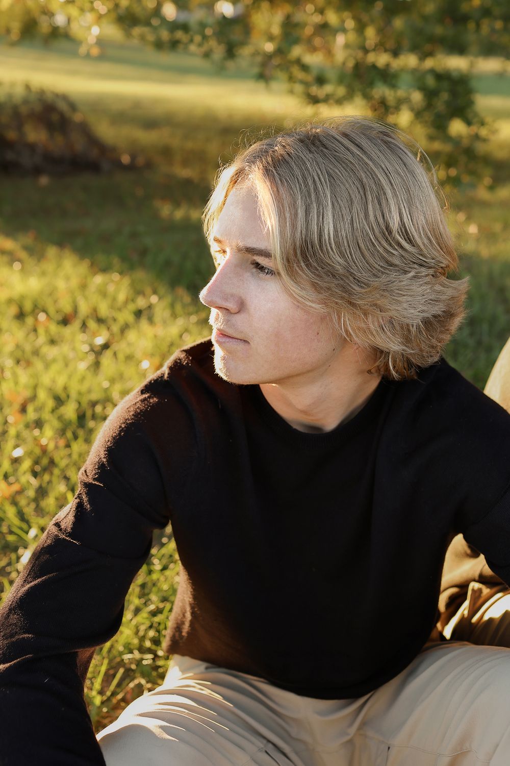 Teenage boy wearing black sweater fall portrait in Springfield MO