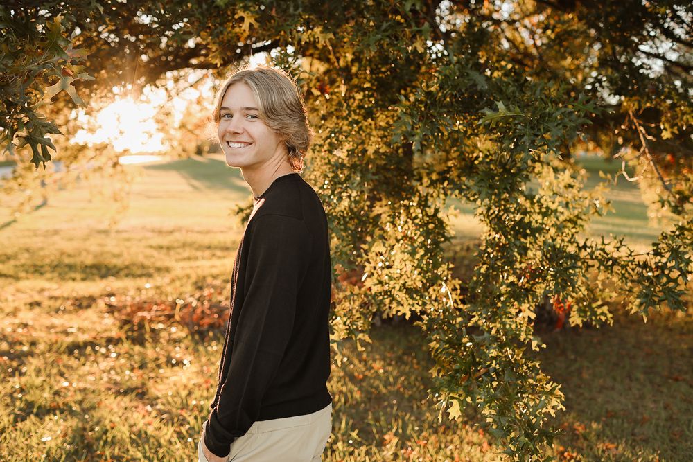 Teenage boy wearing black sweater fall portrait in Springfield MO