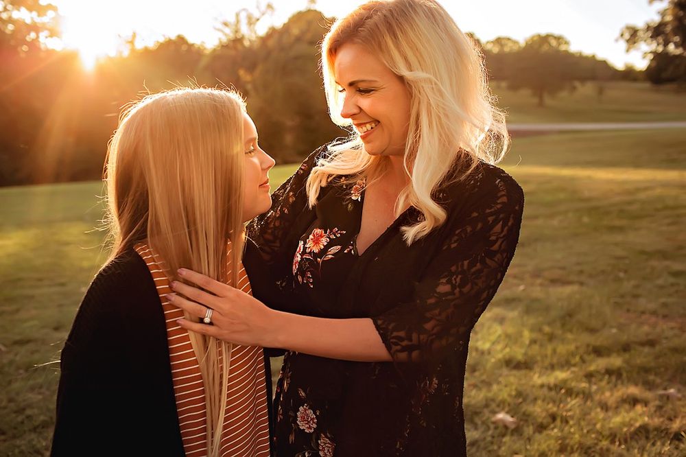 Mother and daughter in field during golden hour in Springfield MO.