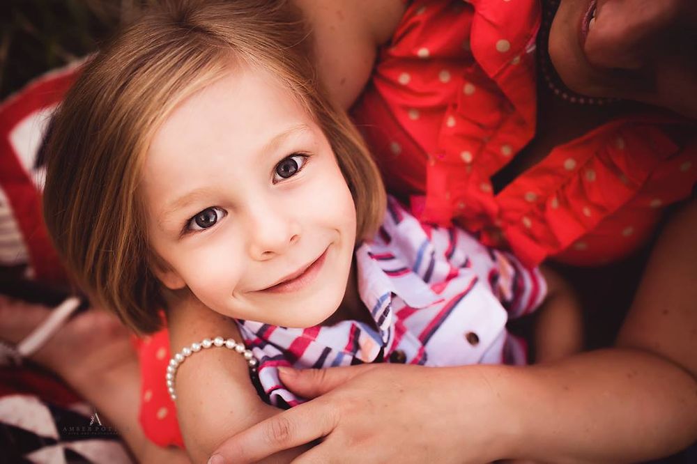 Family hugging during photo session in Springfield MO.