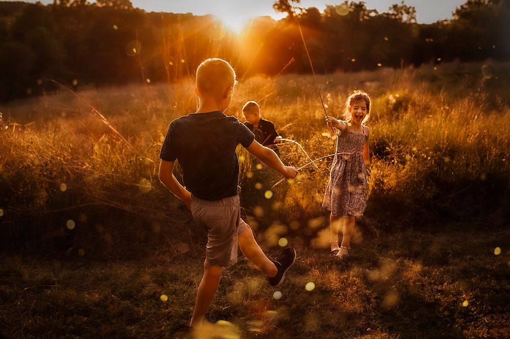 Children playing in field during golden hour light - Springfield Missouri Photographer.