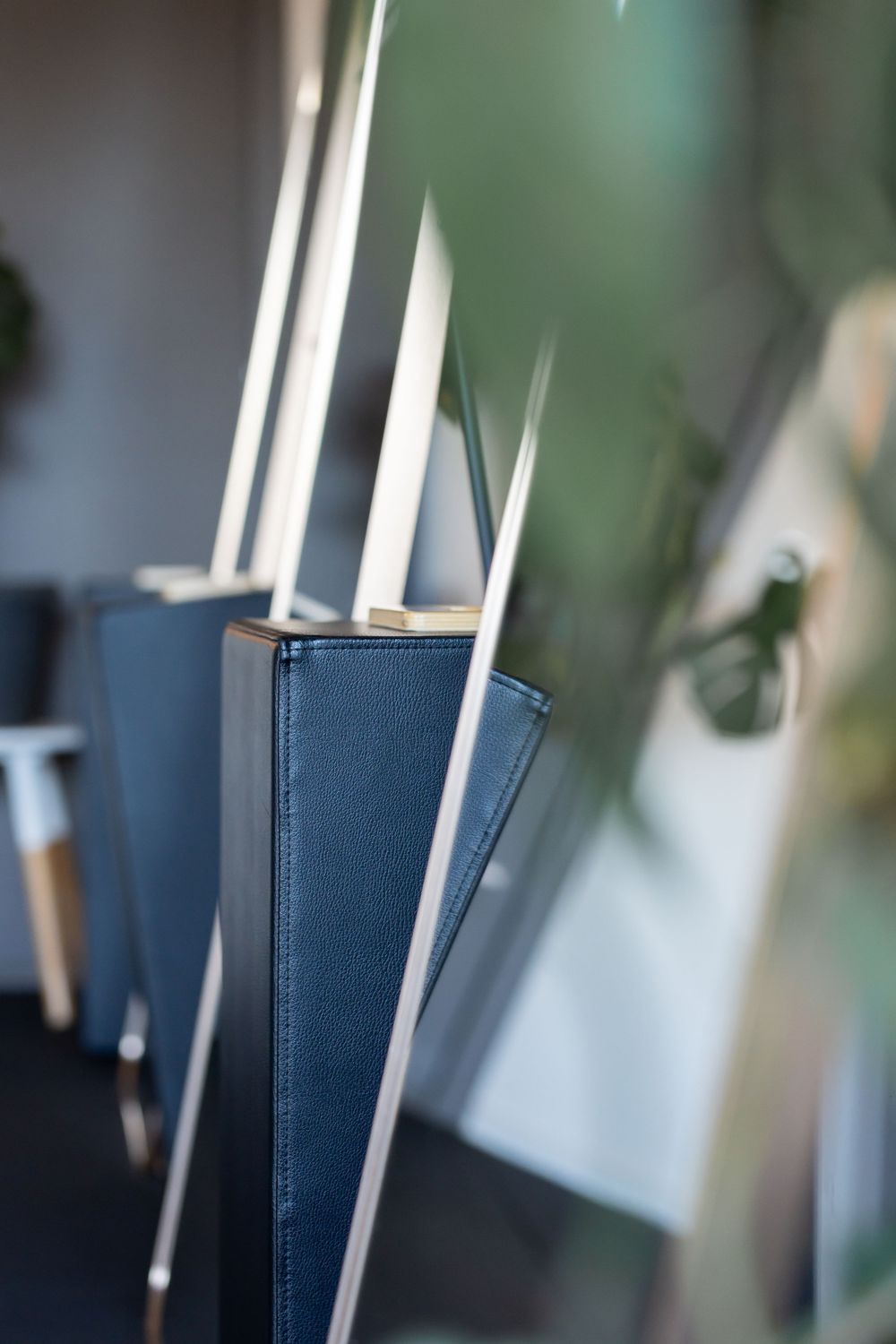 Row of blue hardcover books standing on edge with shallow depth of field.