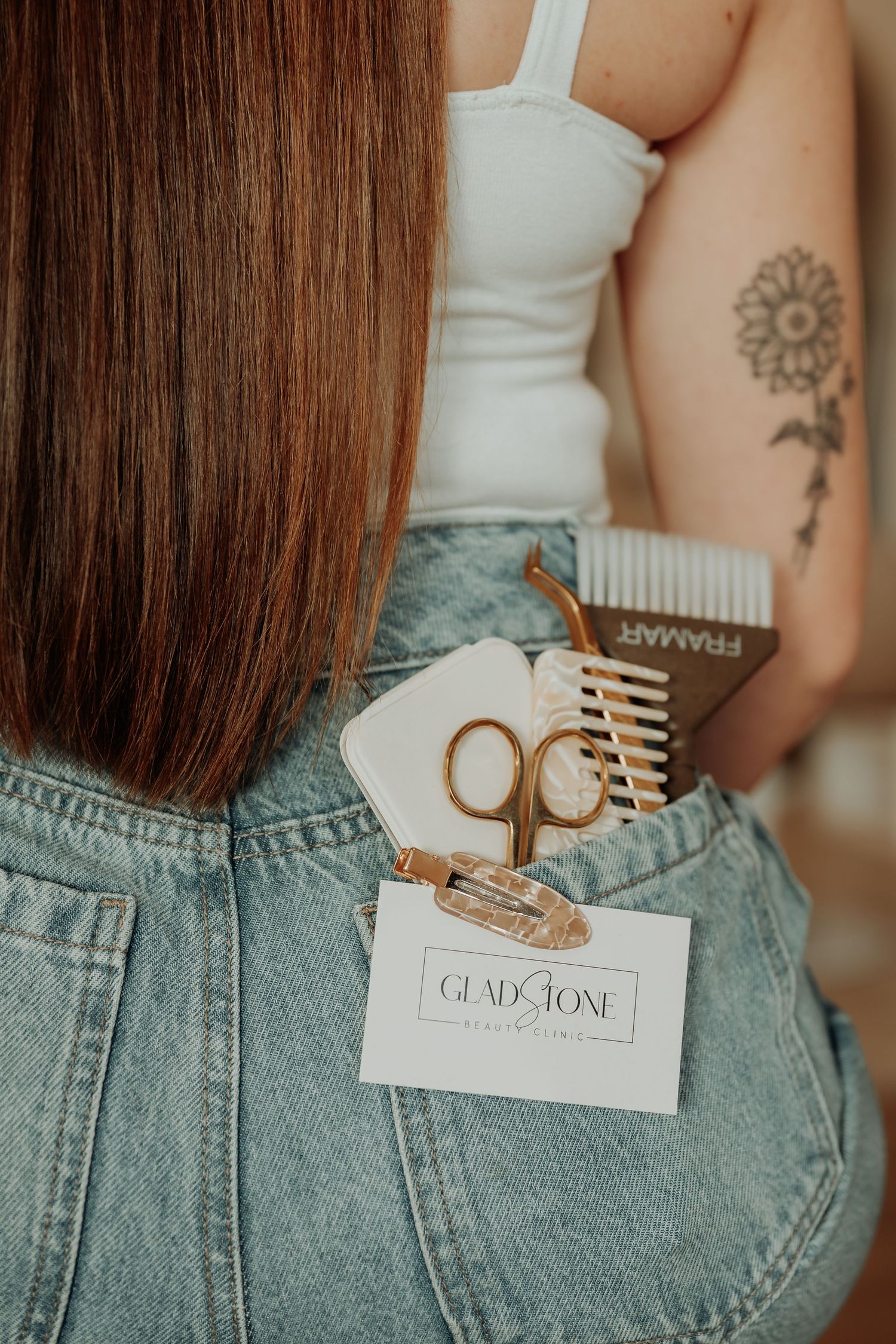 Close-up detail shot of denim jeans pocket with gladstone business cards.