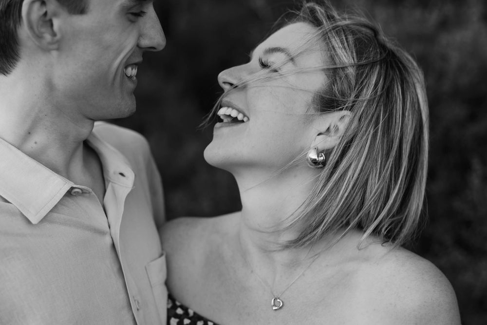 Black and white photo collage showing romantic moments between a couple on their wedding day.