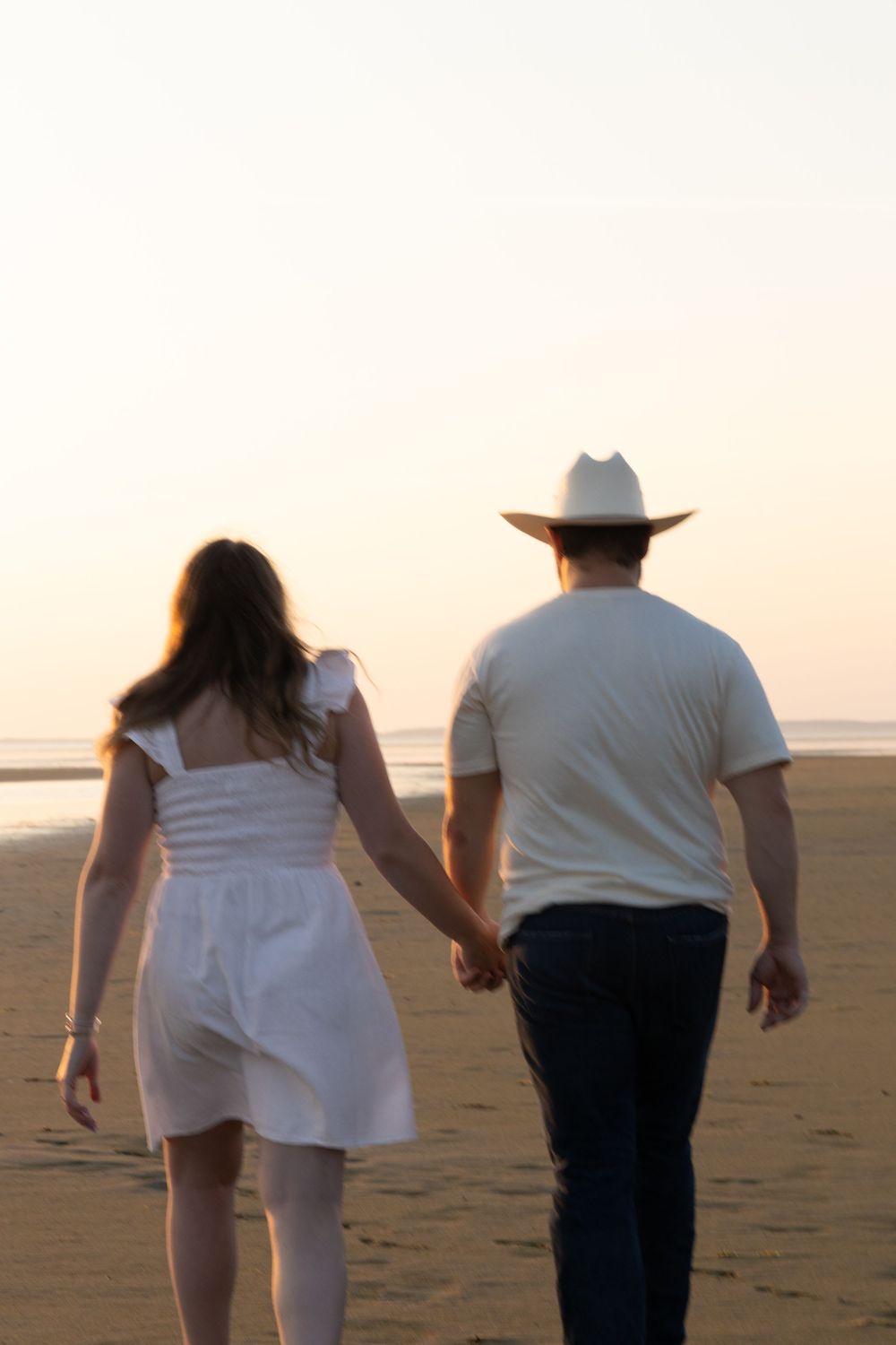 Alex and Kasey are together posing for their engagement photos.
