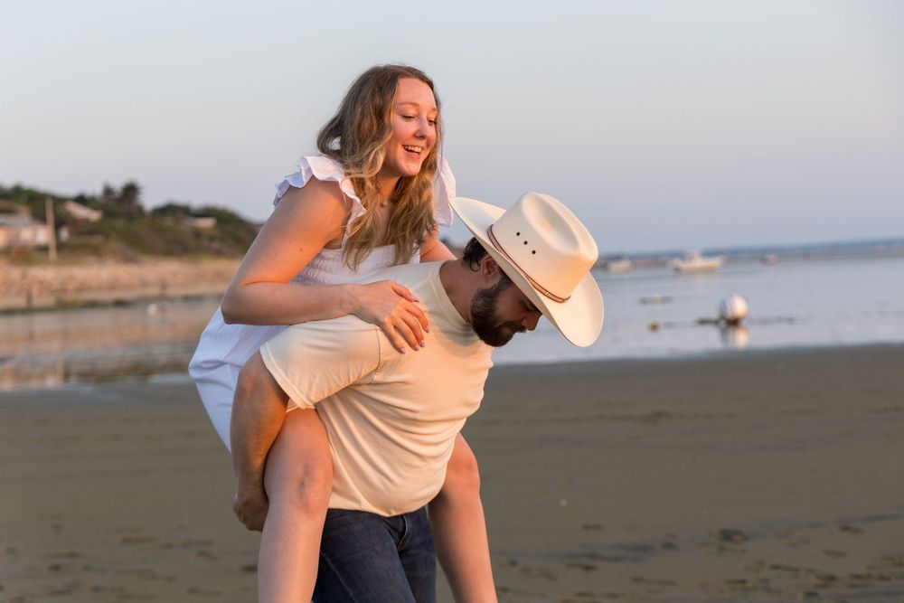 Alex and Kasey are together posing for their engagement photos.