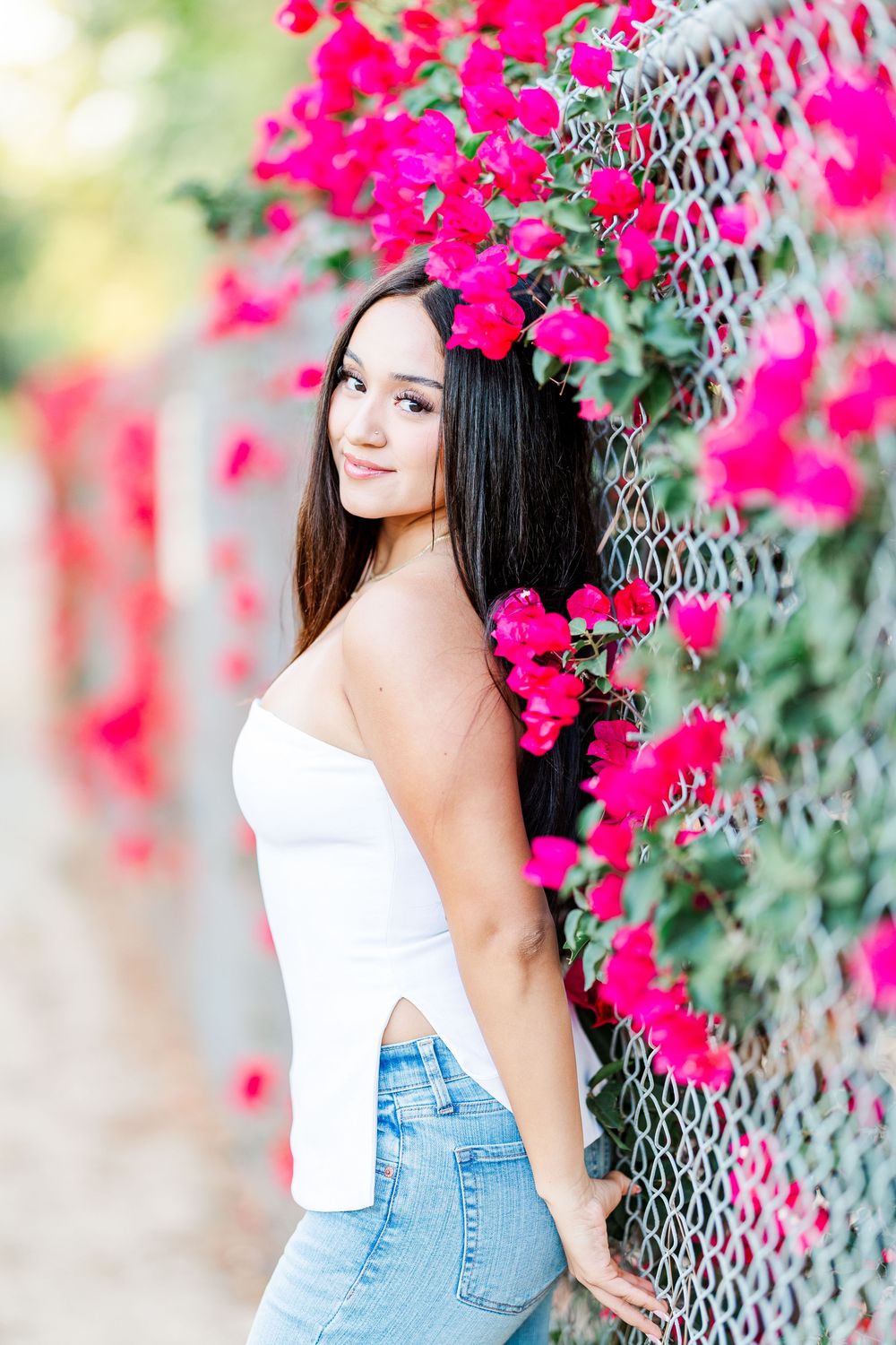 Simi Valley photographer captures Ashlyn in a playful outdoor portrait session at Challenger Park with trees and riverbed backdrops.