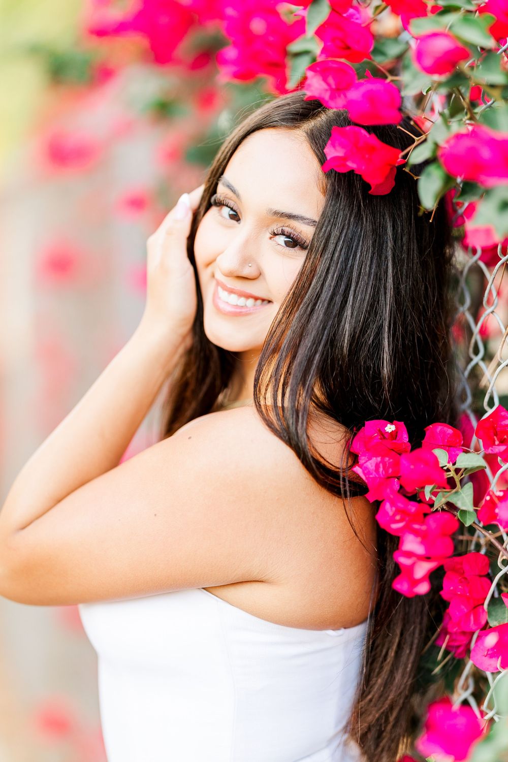 Simi Valley photographer captures Ashlyn in a playful outdoor portrait session at Challenger Park with trees and riverbed backdrops.