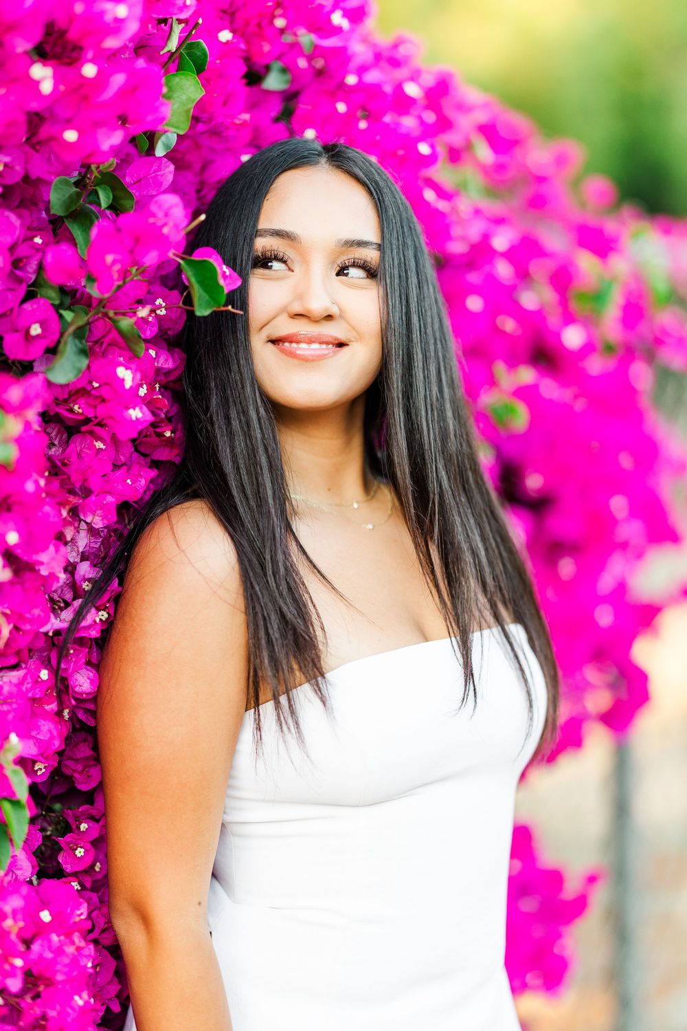 Simi Valley photographer captures Ashlyn in a playful outdoor portrait session at Challenger Park with trees and riverbed backdrops.
