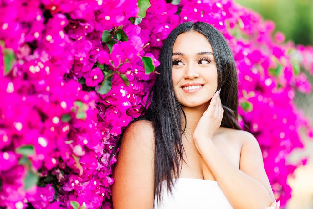 Simi Valley photographer captures Ashlyn in a playful outdoor portrait session at Challenger Park with trees and riverbed backdrops.