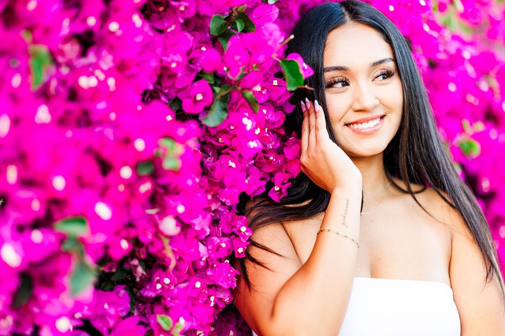 Simi Valley photographer captures Ashlyn in a playful outdoor portrait session at Challenger Park with trees and riverbed backdrops.