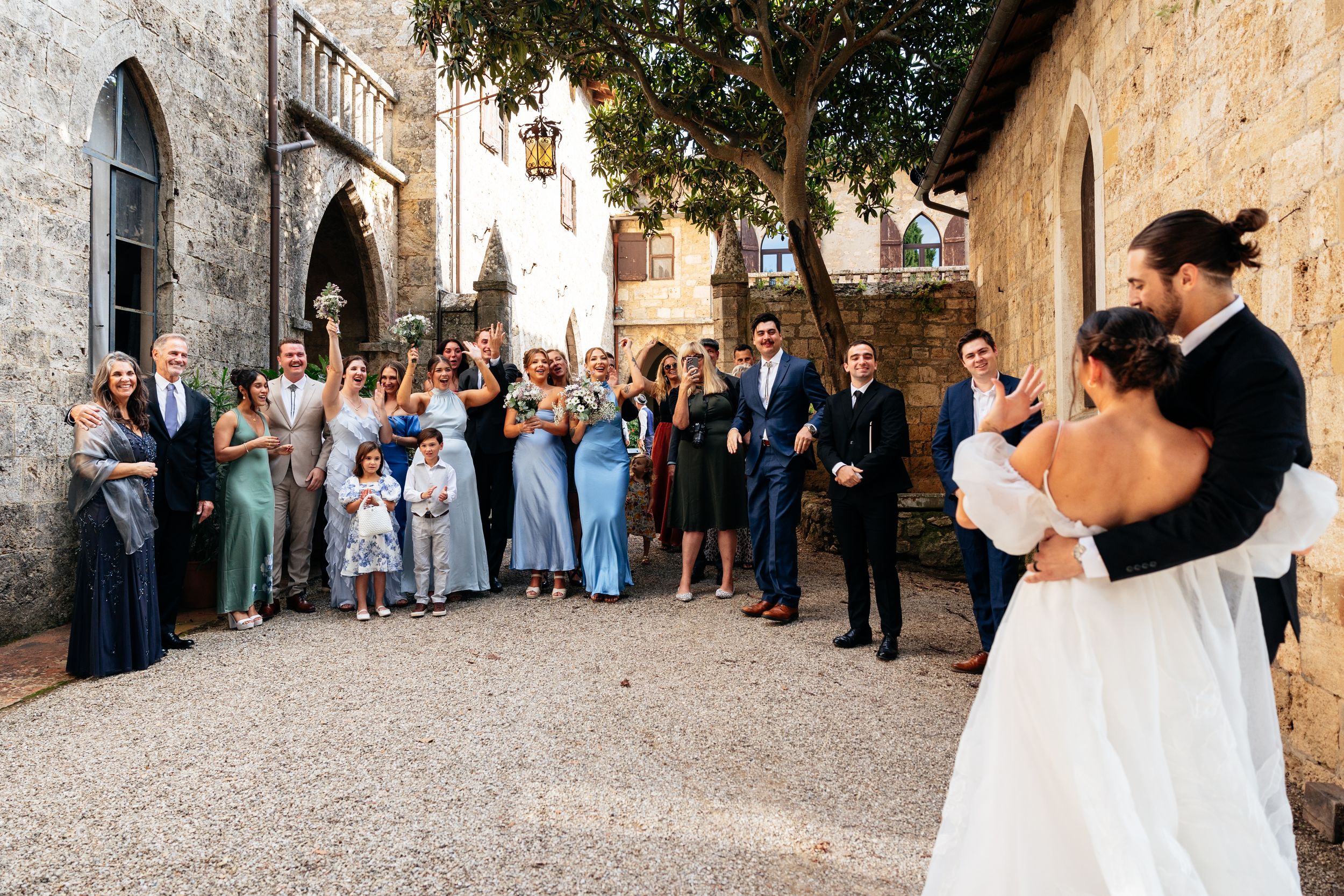 A bride shows off her wedding ring having just gotten married in Tuscany at Castello di Badia.