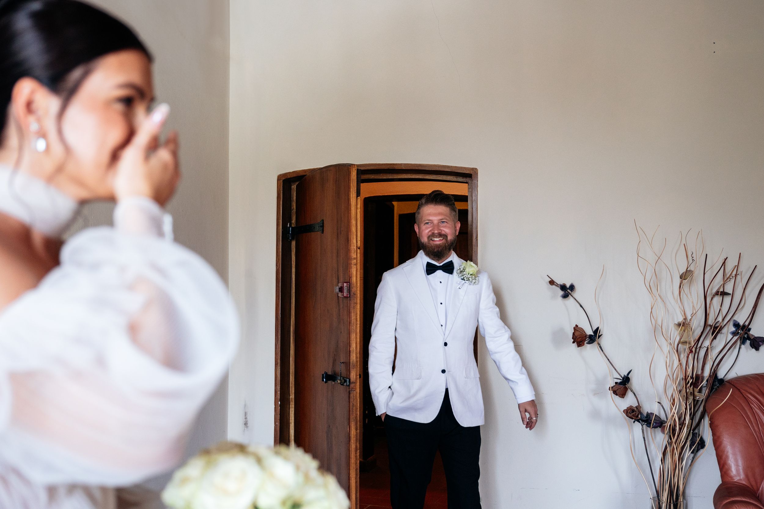 A romantic first look moment at a wedding in Lucca Tuscany.