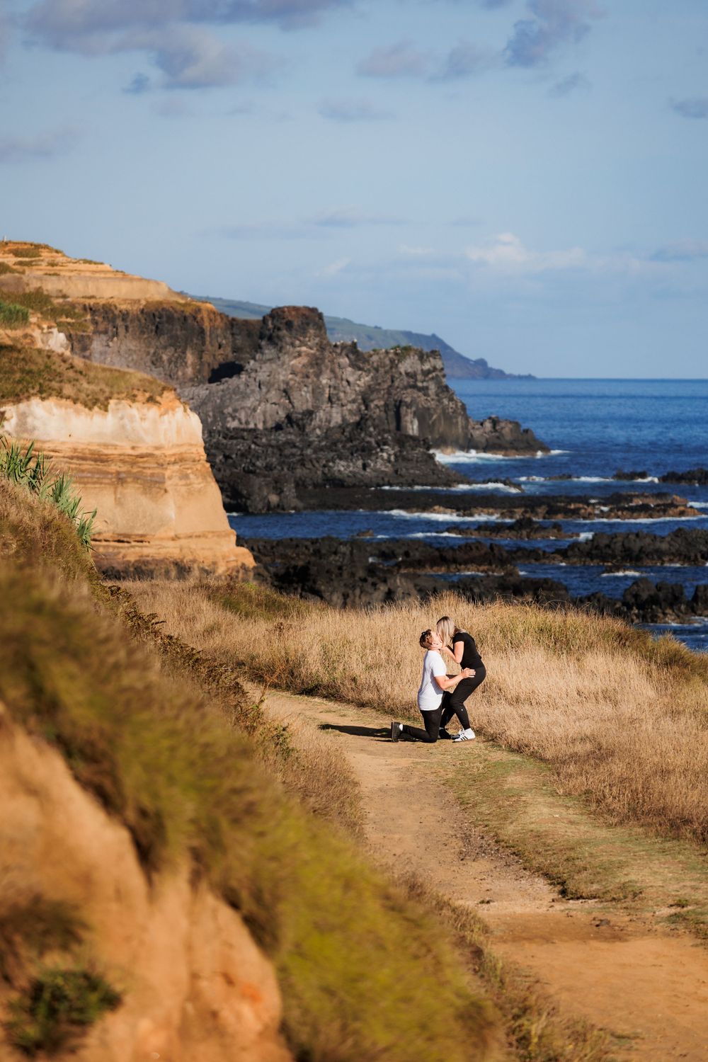Romantic marriage proposal by the Atlantic ocean, at São Miguel island, Azores.