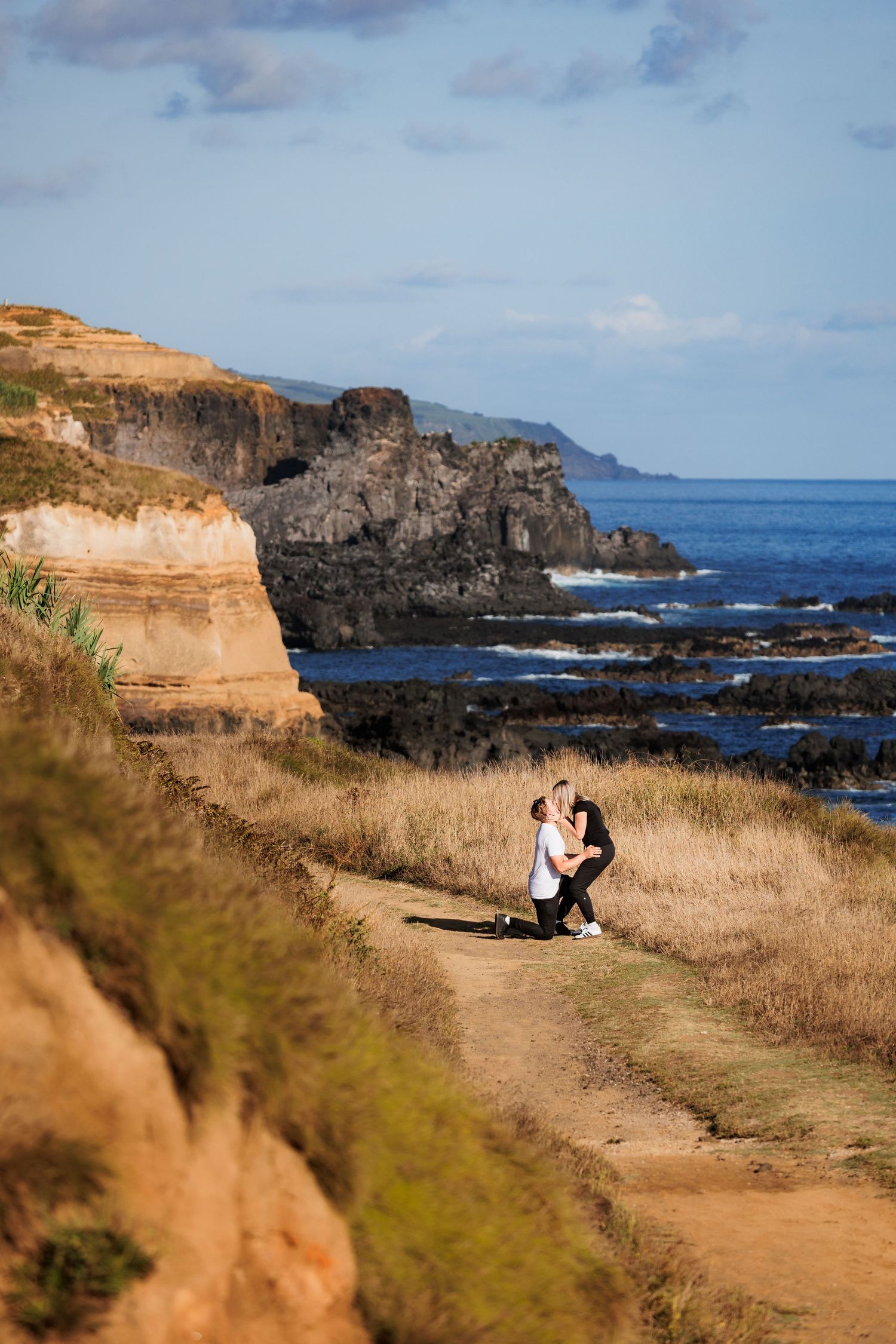 Romantic marriage proposal by the Atlantic ocean, at São Miguel island, Azores.