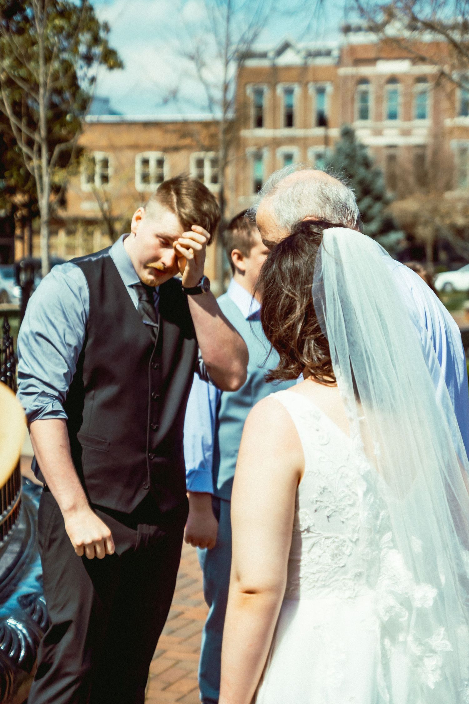 Groom wiping away tears at downtown micro wedding in Bowling Green, Kentucky