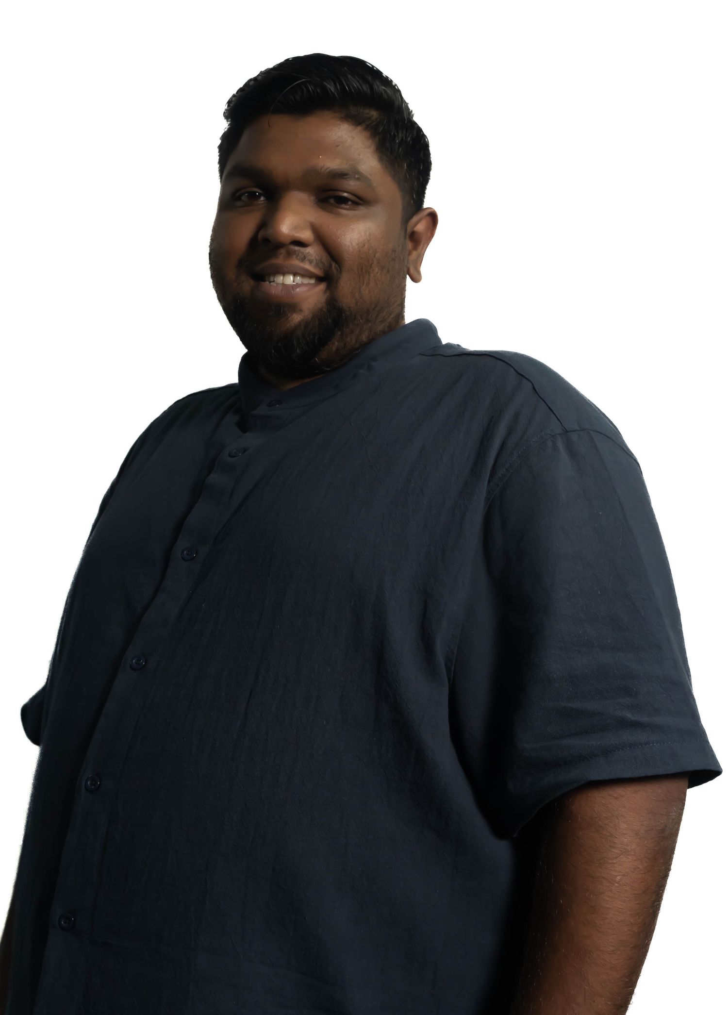 Professional headshot of person wearing dark collared shirt against white background.