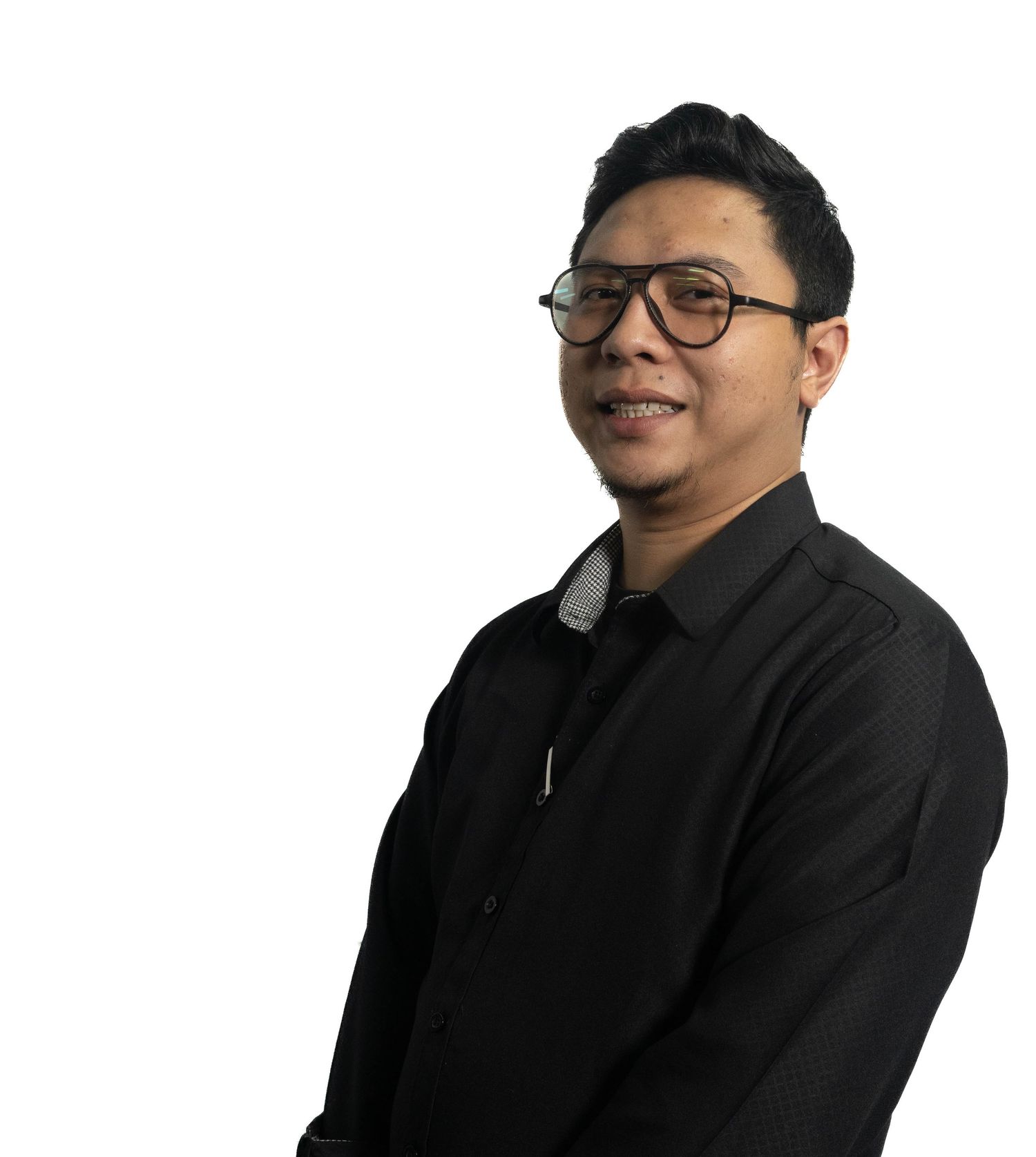 Professional portrait of person wearing glasses and dark shirt against white background.