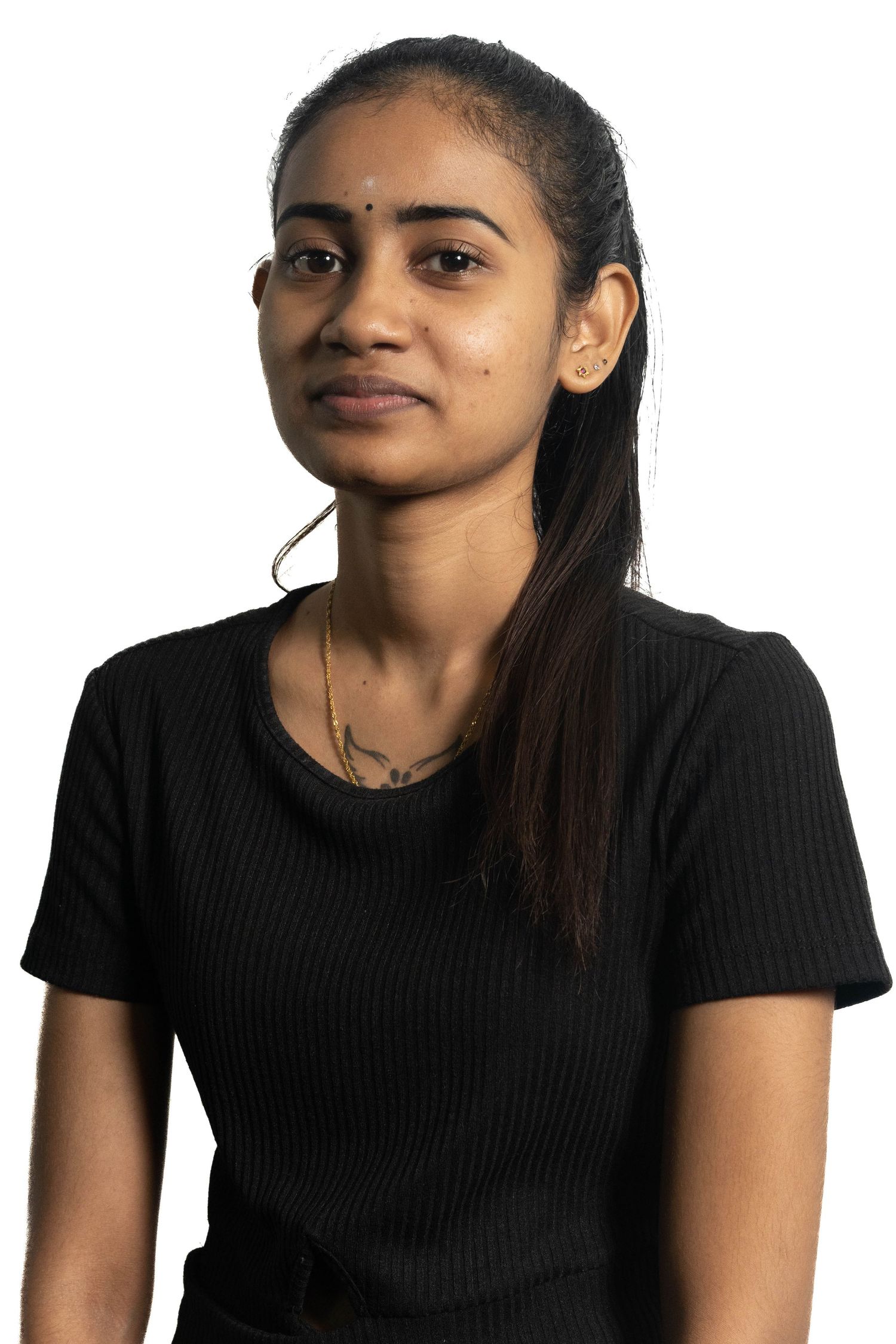 Professional portrait of person wearing black ribbed t-shirt against white background.