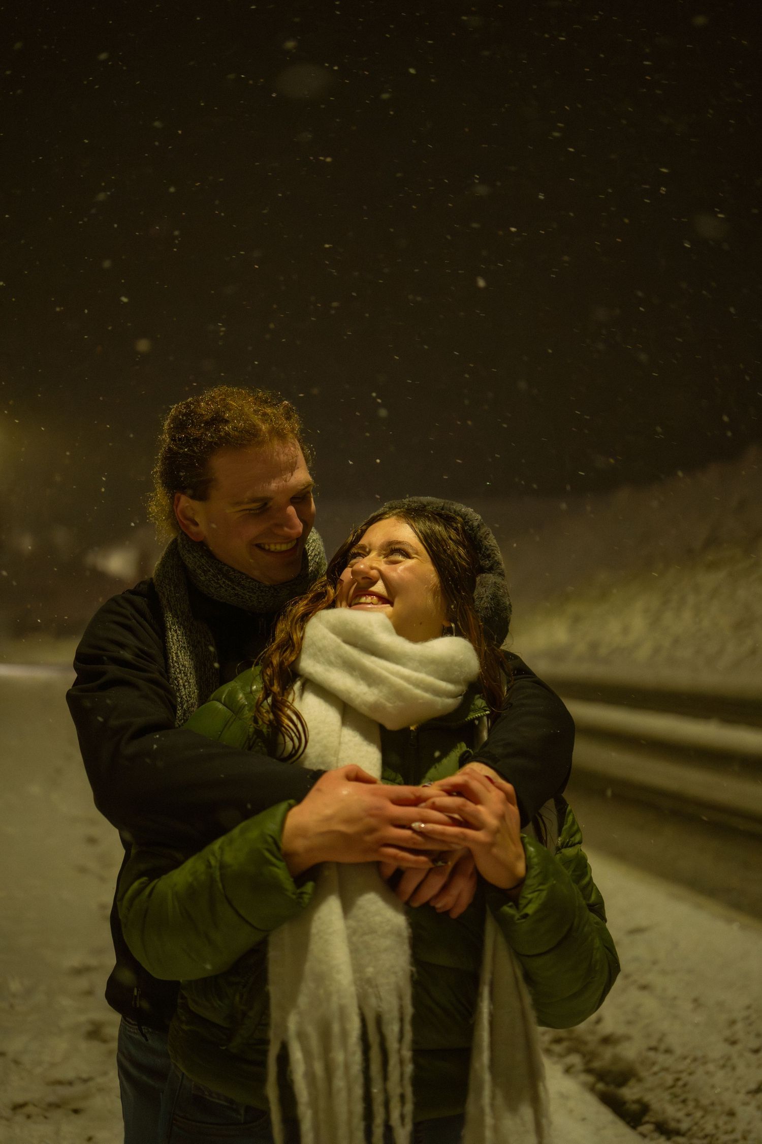 Snowy couples portrait session under a streetlight in Pullman, Washington by Katelyn’s Kandids