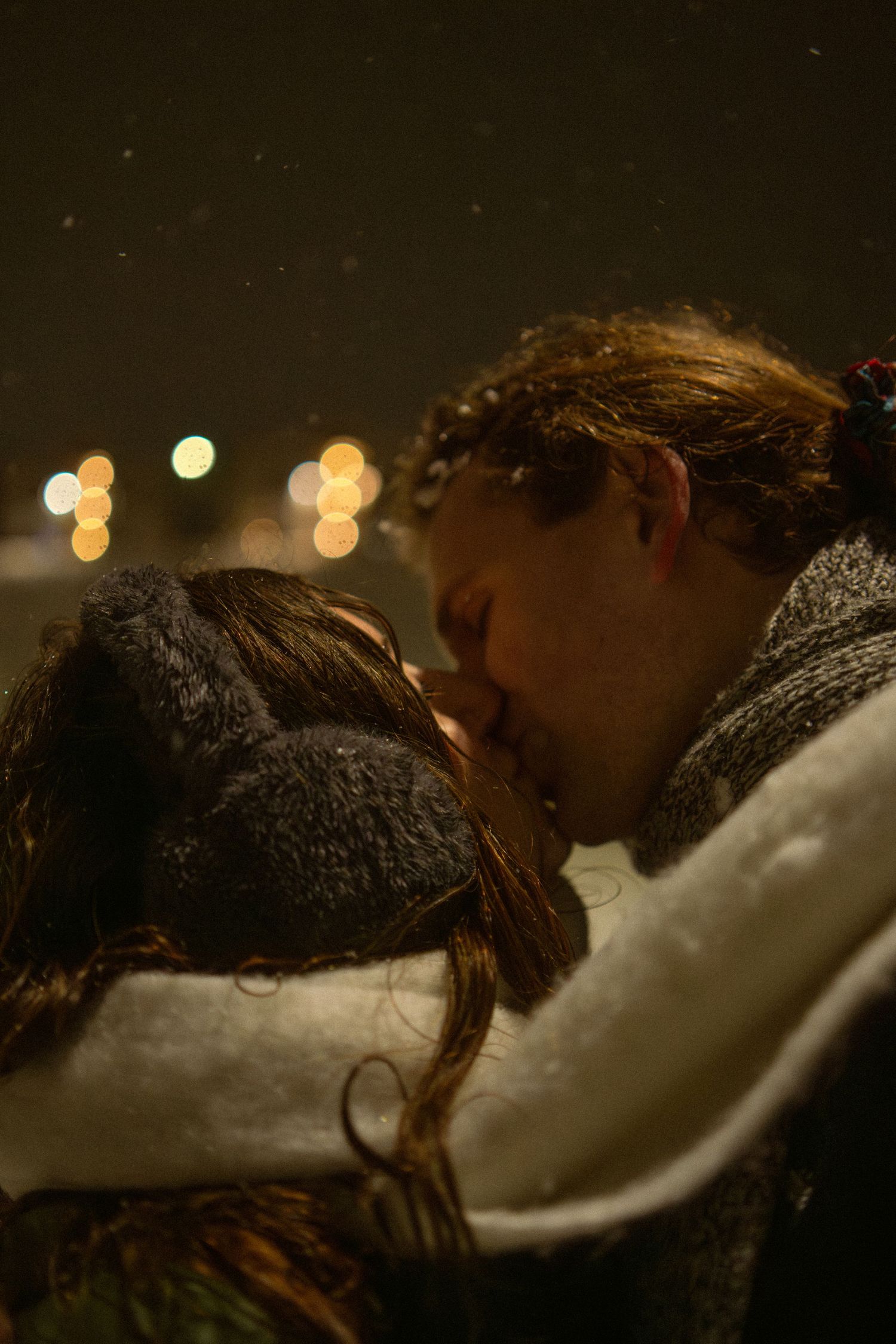 Snowy couples portrait session under a streetlight in Pullman, Washington by Katelyn’s Kandids