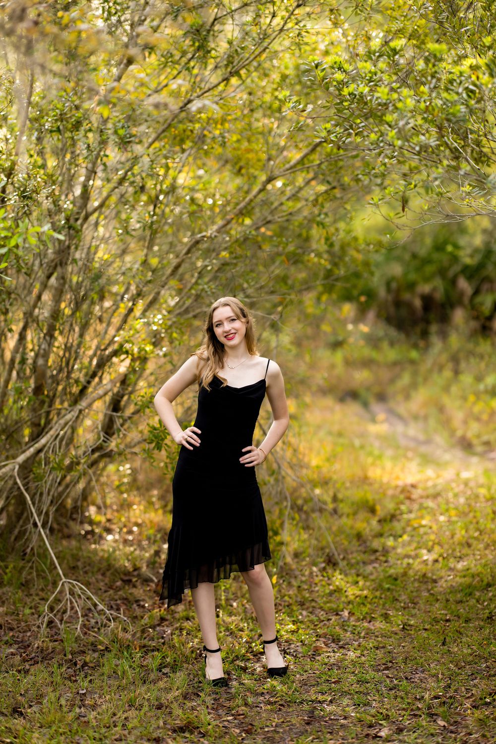 A series of outdoor photos showing a person in a black dress posing against a natural backdrop with autumn foliage.