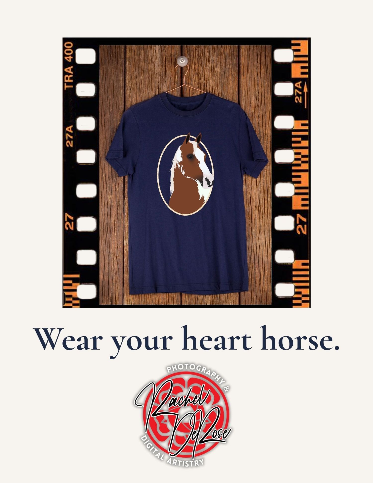 Navy blue t-shirt with white circular horse silhouette design and text 'Wear your heart horse' displayed on wooden background.