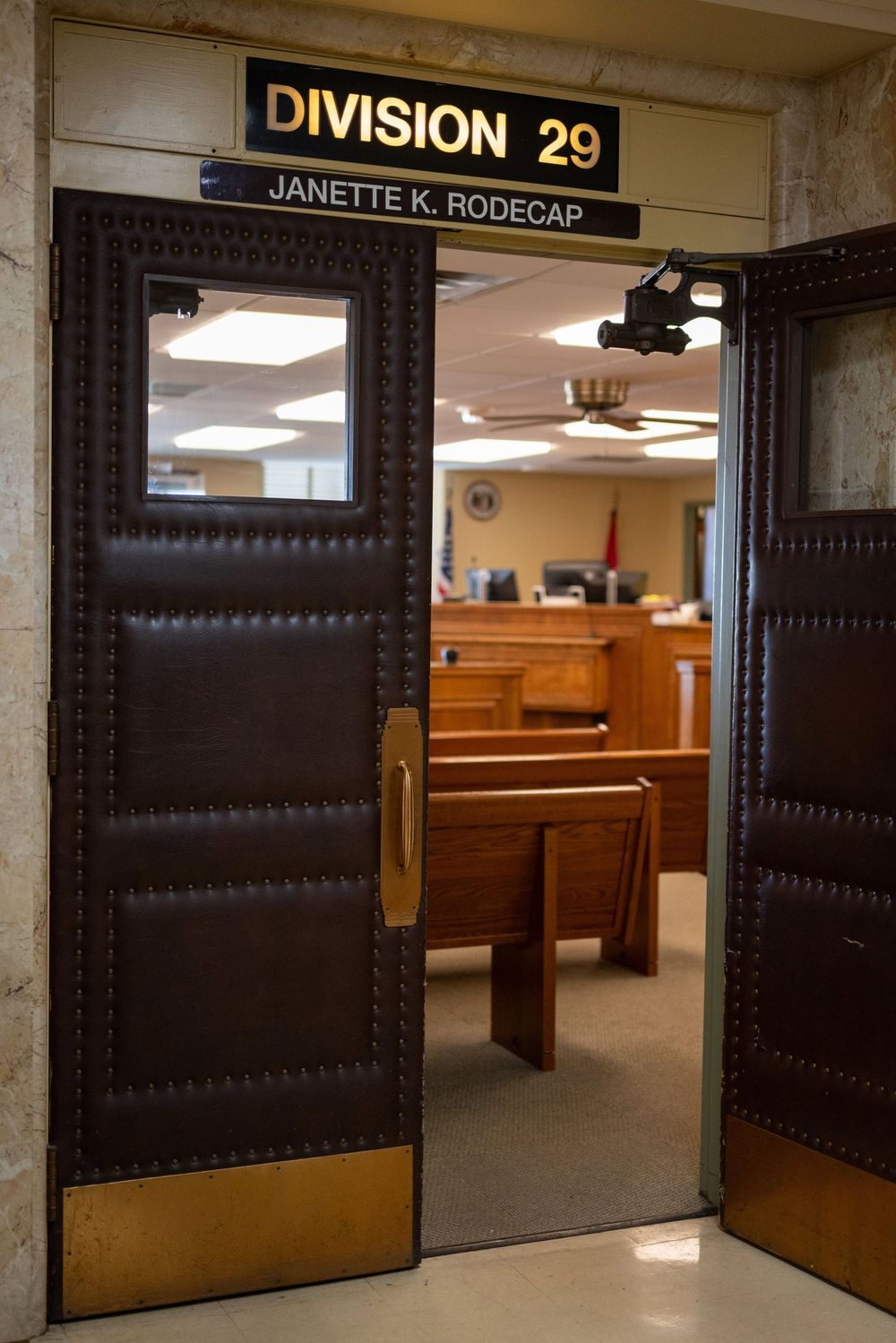Dark wooden courtroom doors with 'Division 29 Janette K. Rodecap' signage above the entrance.