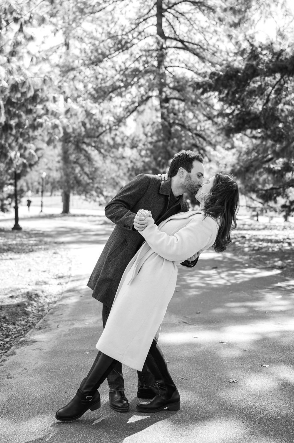 A romantic black and white photo sequence shows a couple dancing in a dip pose on a tree-lined path.