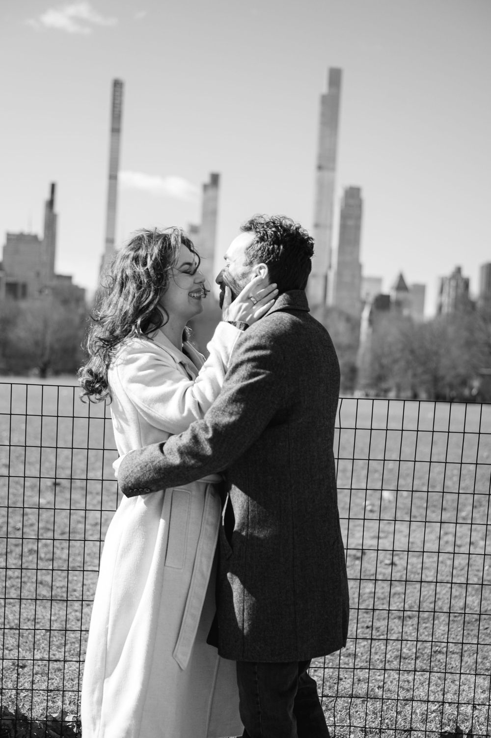 A romantic black and white photo sequence shows a couple embracing against the New York City skyline backdrop.