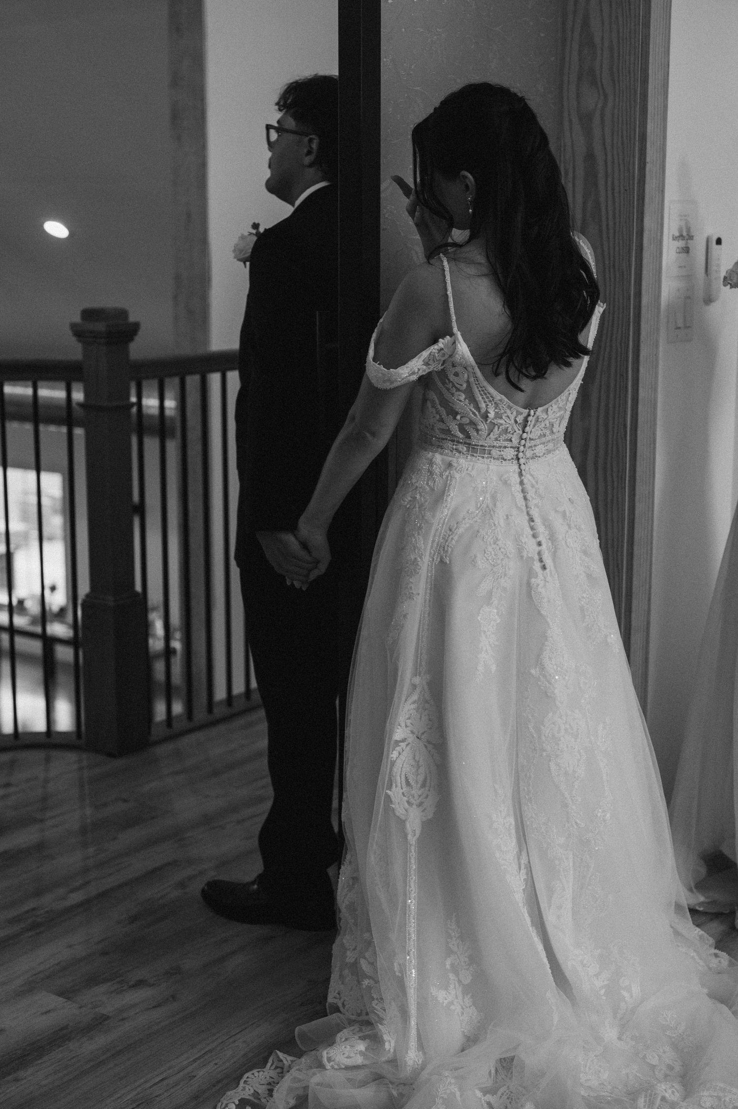 A series of black and white wedding photos showing the back details of a lace wedding dress in different angles.