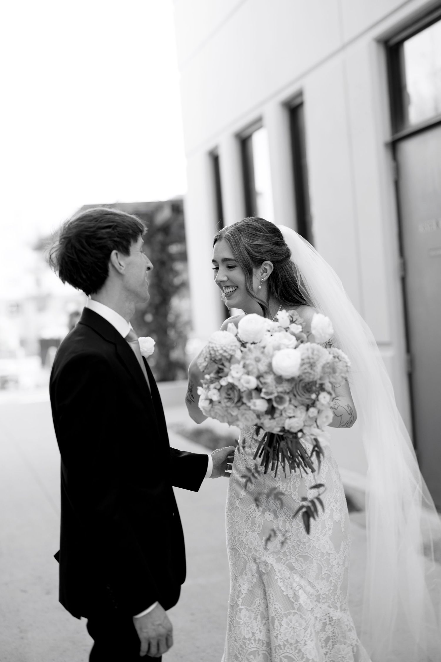 Black and white wedding photos showing intimate moments between the couple.