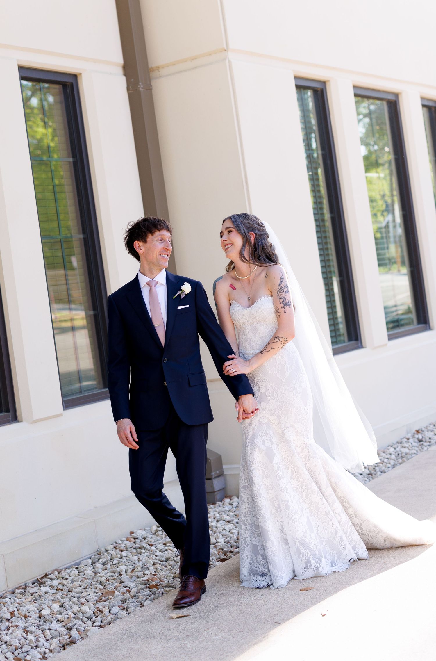 A sequence of wedding photos showing a couple sharing playful moments against a white columned building exterior.