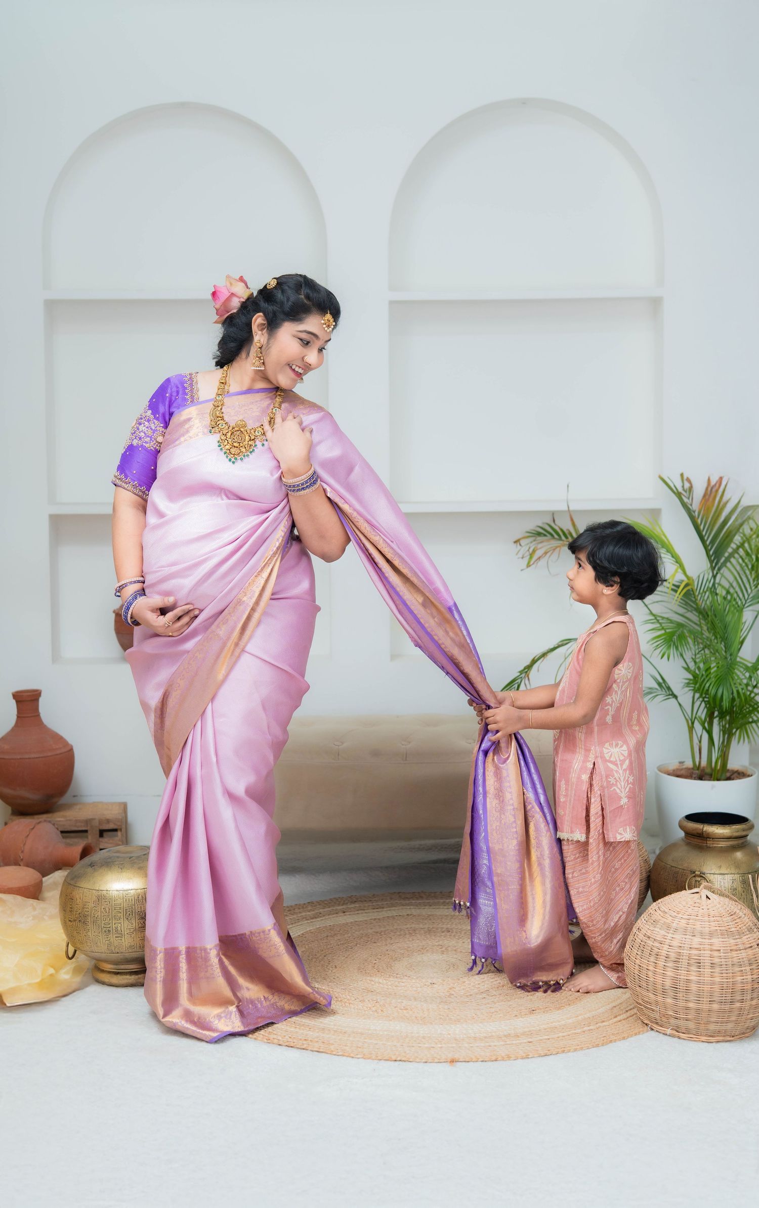 Maternity photoshoot in Hyderabad with mother in saree and toddler, capturing sibling bonding and emotional pregnancy moments